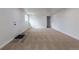 The living room features neutral carpet, white walls, and a door leading outside at 1945 Nome St, Aurora, CO 80010
