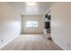 The living room offers neutral carpet, white walls, and a window with natural light at 1945 Nome St, Aurora, CO 80010