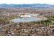 Picturesque aerial view of neighborhood near Berkeley Lake Park with views of the Rocky Mountains at 4824 Knox Ct, Denver, CO 80221