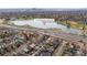 Scenic aerial view of neighborhood near Rocky Mountain Lake Park with downtown Denver skyline in the background at 4824 Knox Ct, Denver, CO 80221