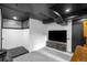 Finished basement with a black drop ceiling and a recreational space at 4824 Knox Ct, Denver, CO 80221