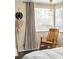 Cozy sitting area in the bedroom with a comfortable rocking chair, lots of natural light at 4824 Knox Ct, Denver, CO 80221