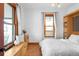Bright bedroom with large window and built-in storage at 4824 Knox Ct, Denver, CO 80221