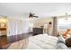 Inviting bedroom with natural light, hardwood floors, and a dressing area with vanity at 4824 Knox Ct, Denver, CO 80221