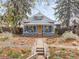 Charming home with a well-manicured front yard and inviting porch, showcasing curb appeal at 4824 Knox Ct, Denver, CO 80221