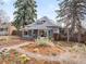 Charming home with a well-manicured front yard and inviting porch, showcasing curb appeal at 4824 Knox Ct, Denver, CO 80221
