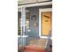 Close-up of the front door with house number, stylish design, and tiled porch at 4824 Knox Ct, Denver, CO 80221