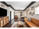 Cozy living room with hardwood floors, leather sofa, and stylish decor at 4824 Knox Ct, Denver, CO 80221
