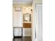 Cute vanity area in the primary bathroom offering great storage and a perfect place to get ready at 4824 Knox Ct, Denver, CO 80221