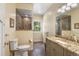 Well-lit bathroom with a tiled glass shower, granite countertop vanity, and neutral color palette at 1555 Three Peaks Rd, Golden, CO 80403