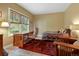 Bright room with hardwood floors, a comfortable daybed, and a large window offering scenic views at 1555 Three Peaks Rd, Golden, CO 80403