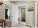 Welcoming entryway with wood accents, neutral walls, and access to interior and exterior spaces at 1555 Three Peaks Rd, Golden, CO 80403