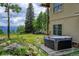Backyard featuring a hot tub at 1555 Three Peaks Rd, Golden, CO 80403