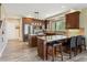Spacious kitchen with custom cabinets, stainless steel appliances, and a granite island with breakfast bar seating at 1555 Three Peaks Rd, Golden, CO 80403