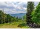 Scenic view of mountains and forest at 1555 Three Peaks Rd, Golden, CO 80403