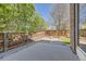 Fenced backyard with a stone patio area with a fire pit, perfect for entertaining at 24763 E Crestridge Pl, Aurora, CO 80016