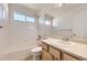 Bright bathroom featuring a vanity with a sink and a shower/tub combo at 24763 E Crestridge Pl, Aurora, CO 80016