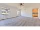 Spacious bedroom with neutral carpet, ceiling fan, and natural light at 24763 E Crestridge Pl, Aurora, CO 80016