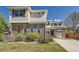Attractive two-story home featuring brick accents, siding, a well-maintained lawn, and an attached garage at 24763 E Crestridge Pl, Aurora, CO 80016