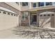 Spacious home with a three-car garage, brick accents, and a covered entrance at 24763 E Crestridge Pl, Aurora, CO 80016