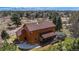 Aerial view of the home showcasing the backyard, deck, and lush surrounding greenery at 7965 Lakeshore Dr, Parker, CO 80134