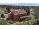 Aerial view of the home showcasing the backyard, deck, and lush surrounding greenery at 7965 Lakeshore Dr, Parker, CO 80134