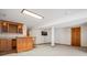 Basement entertaining space featuring a built-in wooden bar and neutral carpeting throughout at 7965 Lakeshore Dr, Parker, CO 80134