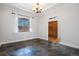 Bright bedroom with large arched window, crown molding, and wood closet doors at 7965 Lakeshore Dr, Parker, CO 80134