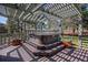 Relaxing outdoor space with a hot tub nestled under a pergola, creating a private retreat at 7965 Lakeshore Dr, Parker, CO 80134