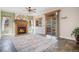 Cozy living room boasts a brick fireplace, slate floors, and sliding doors to the outdoor deck at 7965 Lakeshore Dr, Parker, CO 80134
