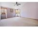 Spacious main bedroom features vaulted ceilings, plush carpet, and several large windows at 7965 Lakeshore Dr, Parker, CO 80134