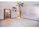 Spacious main bedroom with open door to walk-in closet and ensuite bathroom at 7965 Lakeshore Dr, Parker, CO 80134
