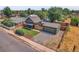 Aerial view of house, detached garage, and street at 2310 S Decatur St, Denver, CO 80219