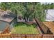 Aerial view showing backyard, detached garage, and fenced yard at 2310 S Decatur St, Denver, CO 80219