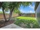 Landscaped backyard with grassy area and mature trees at 2310 S Decatur St, Denver, CO 80219