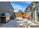 Backyard featuring a patio with a grill, outdoor seating, string lights and a small fire pit at 2310 S Decatur St, Denver, CO 80219