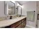 Bathroom with double vanity, modern fixtures and a walk-in shower at 2310 S Decatur St, Denver, CO 80219