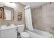 Updated bathroom with tub, toilet and vanity at 2310 S Decatur St, Denver, CO 80219