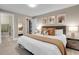 Well-lit bedroom with neutral tones and closet access to a laundry at 2310 S Decatur St, Denver, CO 80219