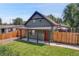 Charming single-Gathering home with well-maintained lawn, a welcoming porch, and beautiful curb appeal at 2310 S Decatur St, Denver, CO 80219