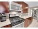 Stainless steel appliances and granite countertops are featured in this kitchen at 2310 S Decatur St, Denver, CO 80219