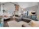 Inviting living room featuring a sectional sofa, home decorations and sliding barn door at 2310 S Decatur St, Denver, CO 80219