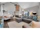 Open living space with vaulted ceiling and a sliding barn door at 2310 S Decatur St, Denver, CO 80219