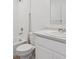 Bathroom featuring a toilet, vanity, and a bathtub with white tile, providing a functional and clean space at 681 N Tempe St, Aurora, CO 80018