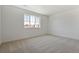 Inviting bedroom featuring plush carpeting, ample natural light, and a neutral color scheme at 681 N Tempe St, Aurora, CO 80018
