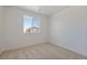Bright bedroom showcasing a large window with outside views, offering a serene and relaxing atmosphere at 681 N Tempe St, Aurora, CO 80018