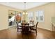 Dining room features a round table and sliding glass doors to the patio at 14672 Melco Ave, Parker, CO 80134