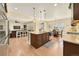 Spacious kitchen with island seating, modern appliances, and an open floor plan at 14672 Melco Ave, Parker, CO 80134