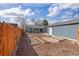 Backyard featuring a garden, patio, and a detached garage and a privacy fence at 4280 S Pearl St, Englewood, CO 80113