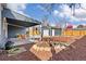 Backyard featuring a covered patio, fire pit and well-maintained detached garage and landscaping at 4280 S Pearl St, Englewood, CO 80113